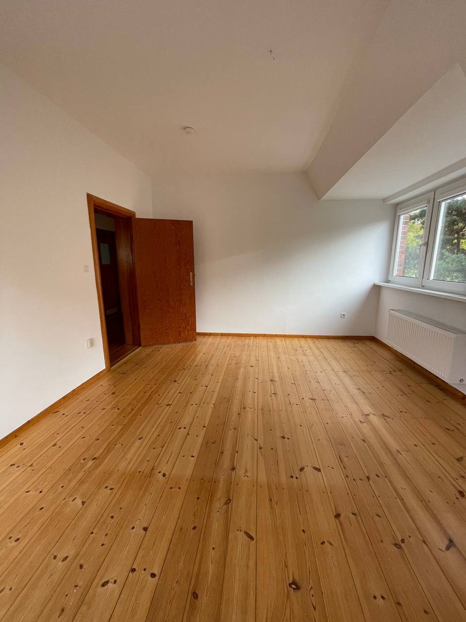 Bedroom with original pine floorboards