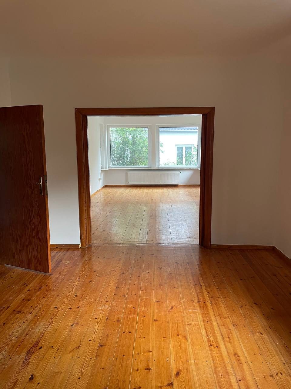 Living rooms linked by a sliding door